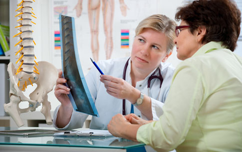 Doctor reviewing x-rays with patient